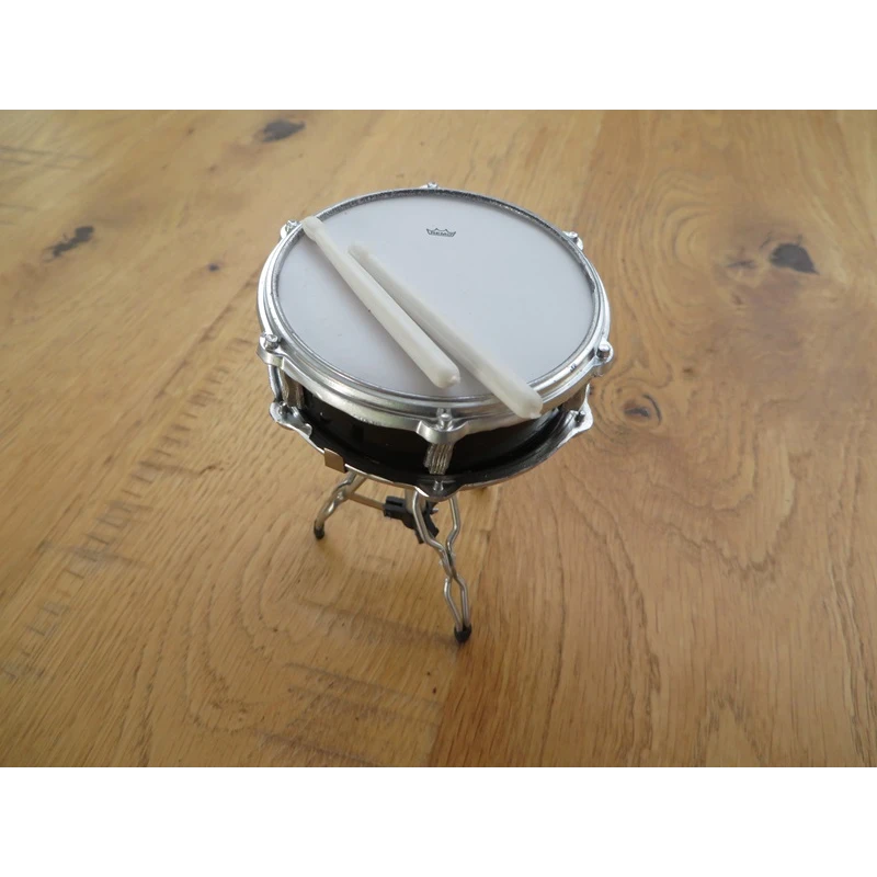 Miniature snare drum on stand with sticks (detailed example)